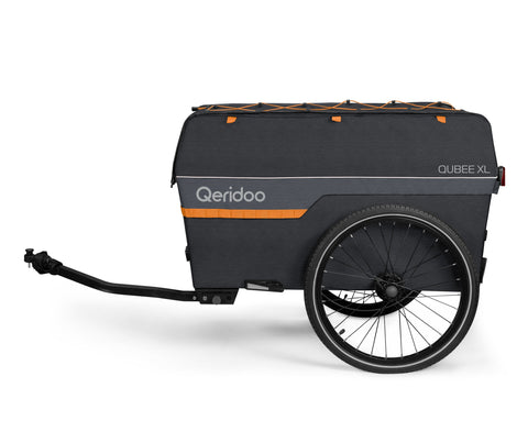 A black cargo bike trailer with a hitch, featuring the 'Qeridoo' brand name and 'CUBE XL' text on the side, with a top cargo rack, shown against a plain white background.