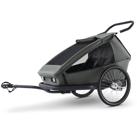 Croozer Ellma Moss Green stroller bike trailer in dark gray and black, featuring a large canopy, two wheels, and a front suspension hitch, shown on a clean white background.