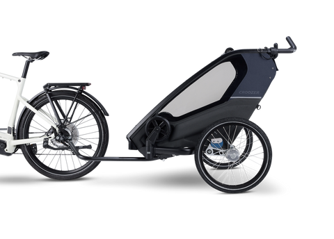 Croozer Kid Lykke 2 Blueberry Blue — mounted on a bicycle